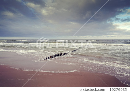 Vintage toned stormy sky over rough sea 19276985