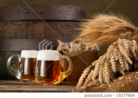 two beer glasses with wheat and barley 19277609