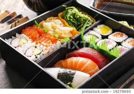 bento box with sushi and rolls 19278693
