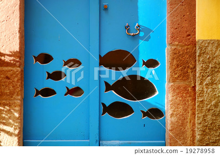 Fish cut out of blue door in Italy 19278958
