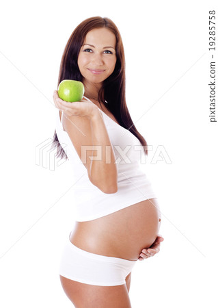 Pregnant woman with apple. 19285758
