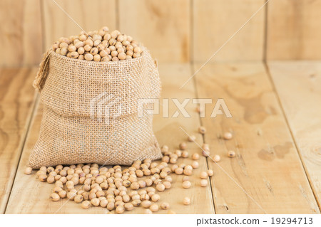 Soy beans in sack on wooden desk 19294713