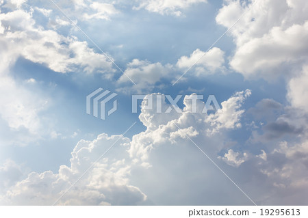 Beautiful light blue sky with puffy white clouds 19295613