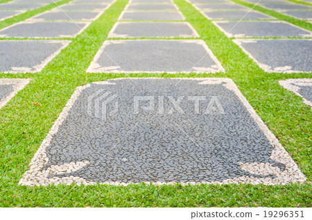 path with grass growing up between the stones path with grass growing up between the stones 19296351