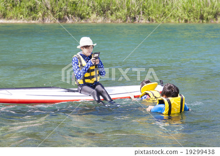 Parents playing marine sports 19299438