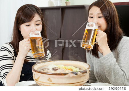 Woman smile appetite hot pot cooking Japanese cooking pot party beer Woman smile appetite hot pot cooking Japanese cooking pot party beer 19299658