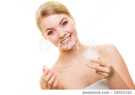 Skin care. Girl applying moisturizing cream. 19303192