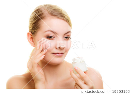 Skin care. Girl applying moisturizing cream. 19303193