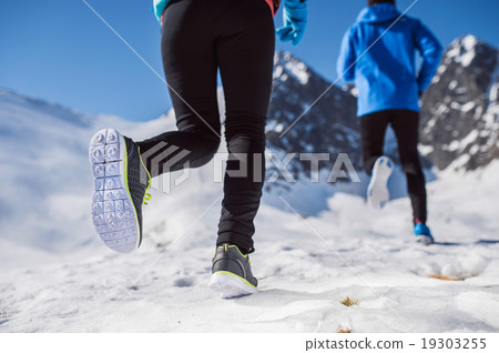 Legs of two runners 19303255