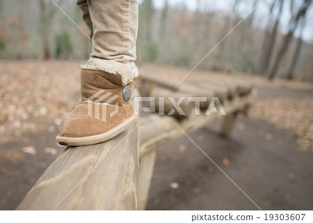 Child's leg crossing the board 19303607