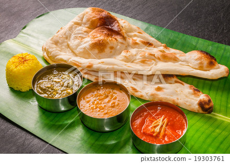 Nan and Indian curry Naan and three colors of... - Stock Photo ...