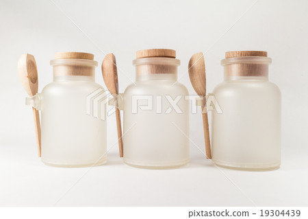 Empty bottle with wood spoon 19304439