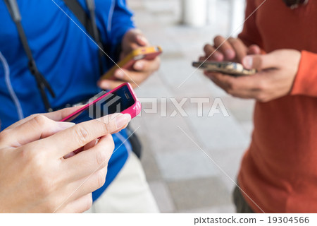 People are using phone to find directions People are using phone to find directions 19304566