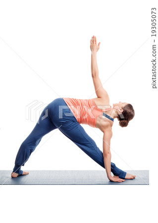 Sporty woman practices Ashtanga Vinyasa yoga asana 19305073