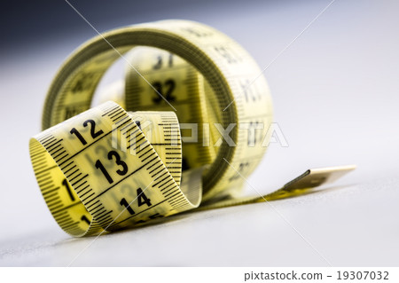 Curved measuring tape. Measuring tape of tailor.  19307032