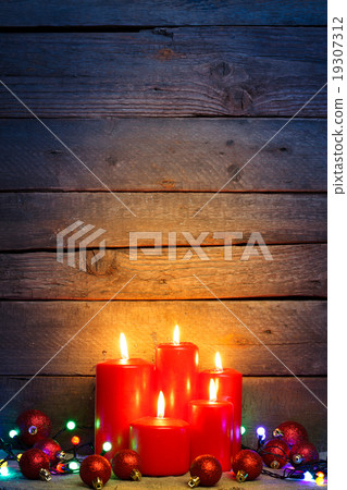 Red candles with Christmas ornament balls 19307312