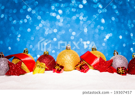 christmas ornament in snow on glitter background 19307457