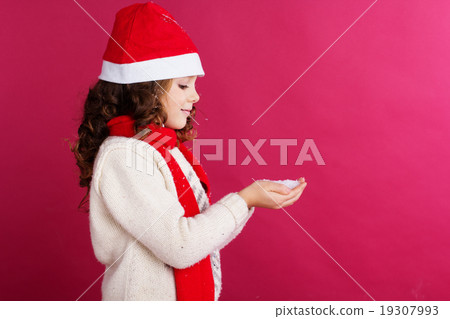 Little girl is holding fake snow in hands Little girl is holding fake snow in hands 19307993