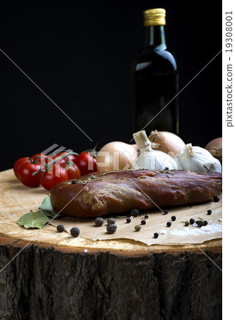 Smoked pork loin with herbs and spices. Smoked pork loin with herbs and spices. 19308001