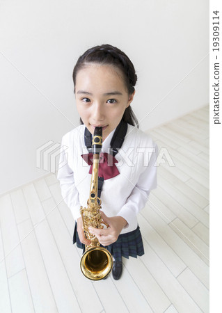 Junior high school girl playing sax Junior high school girl playing sax 19309114