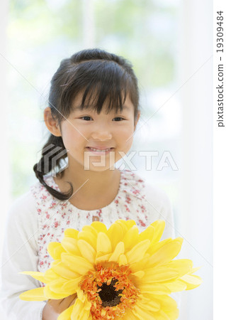 Girls with yellow flowers 19309484