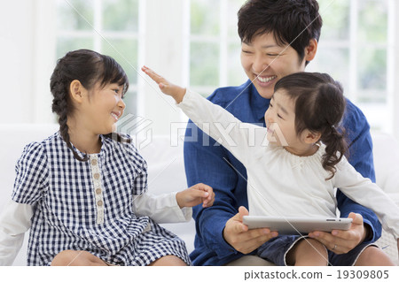 Father and daughter sitting on the sofa Father and daughter sitting on the sofa 19309805