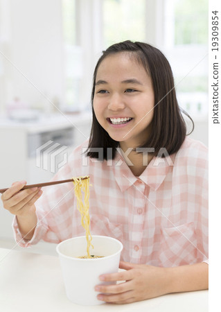Girls eating cup ramen 19309854