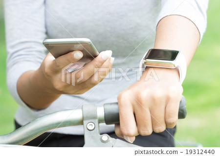 Women using phone and hand watch Women using phone and hand watch 19312440