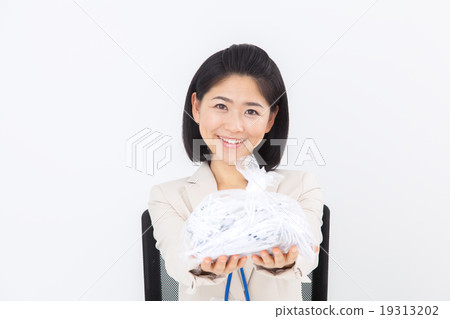 Business woman discarding shredder garbage Business woman discarding shredder garbage 19313202