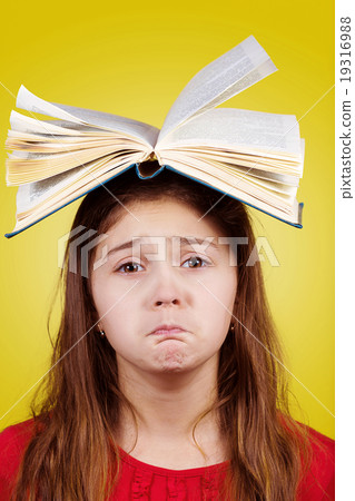 Sad Portrait of a cute little schoolgirl 19316988