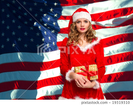 Girl dressed as Santa Claus 19319310