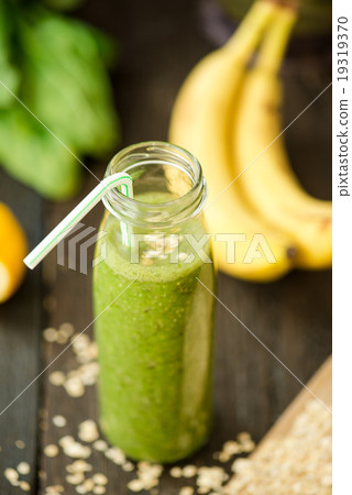 fresh detox green smoothie with spinach 19319370