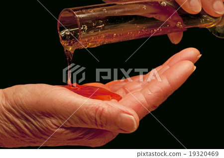 hand with liquid soap 19320469
