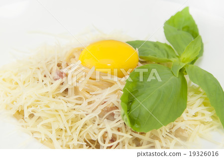 spaghetti with cheese and egg on a white plate in spaghetti with cheese and egg on a white plate in 19326016