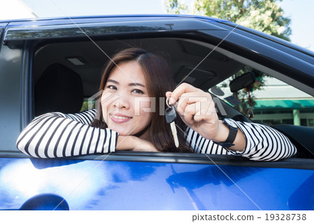 Asian car driver woman smiling showing car keys 19328738