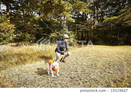 A man walking with a pet A man walking with a pet 19329687