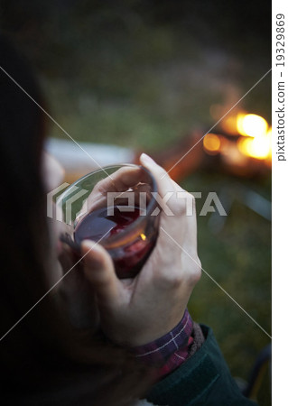 A woman drinking wine 19329869
