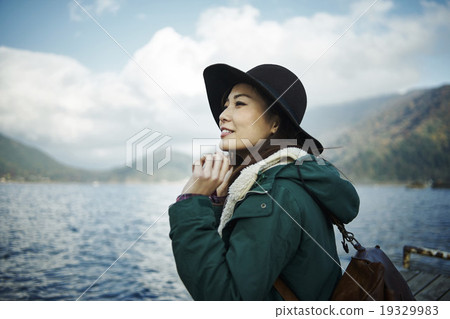Women refreshing at the lake 19329983