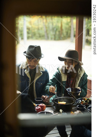 A couple who enjoys eating with friends 19330242