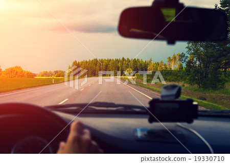 Driving a car on asphalt road Driving a car on asphalt road 19330710