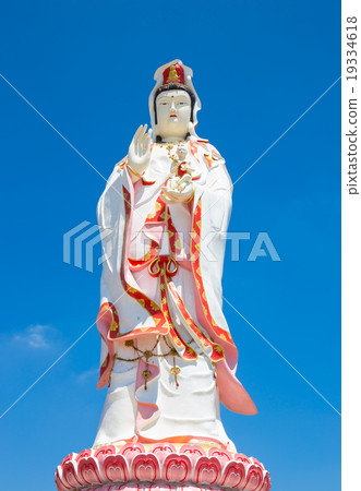 Statue of the Goddess Guanyin on blue sky Statue of the Goddess Guanyin on blue sky 19334618
