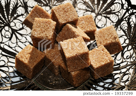 pieces of brown sugar in vintage bowl pieces of brown sugar in vintage bowl 19337299