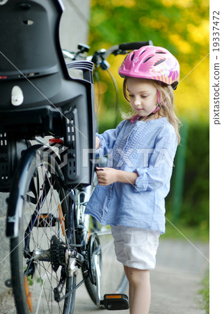 Little girl ready to ride a bicycle Little girl ready to ride a bicycle 19337472