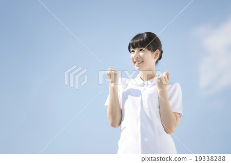 Nurse doing guts pose (sky background) 19338288