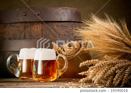 two beer glasses with wheat and barley 19340016