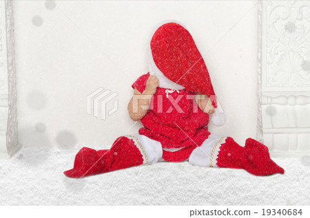 Small girl in Santa suit sitting on floor with snow Small girl in Santa suit sitting on floor with snow 19340684