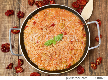 vegetarian paella on a wooden table 19340873