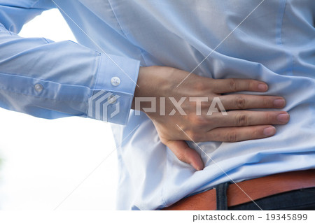 Stock Photo: Man in office uniform having back pain injury