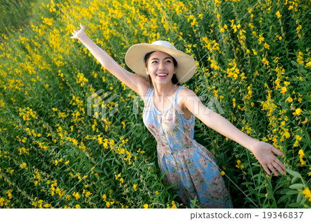 Freedom girl enjoying with flowers on field, Freedom girl enjoying with flowers on field, 19346837