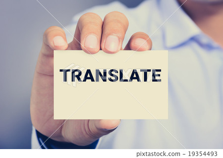 TRANSLATE word on the card held by a man hand TRANSLATE word on the card held by a man hand 19354493